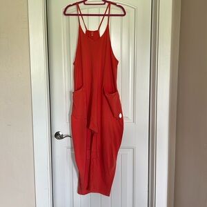 NWOT free people onesie ! Vibrant melon color!